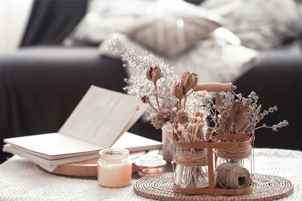 air dried roses decorate a beautiful table in a cozy home